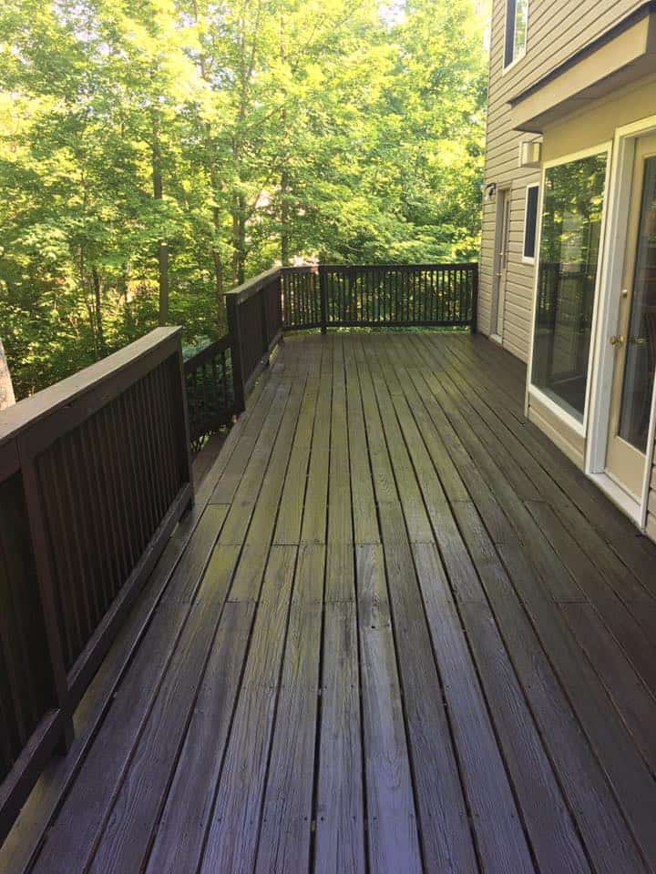 Dark stained deck and fence